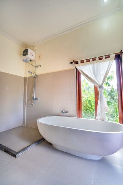 Deluxe Room, 1 King Bed, Pool View | Bathroom | Shower, hair dryer, slippers, towels