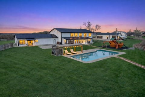 Escape to a beautifully designed outdoor retreat featuring a refreshing pool, expansive patio, and ample space for both relaxation and recreation. Perfect for enjoying sunny afternoons, outdoor dining, and quality time with family and friends.
