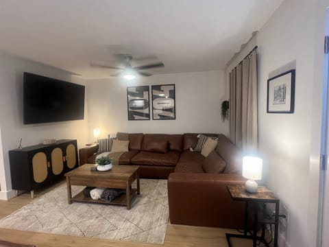 Living room with oversized couch and smart tv