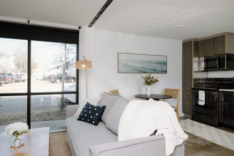Relax in the cozy downstairs living space equipped with a Roku Smart TV, high-speed Wi-Fi, and a fold-out couch for additional sleeping space.
