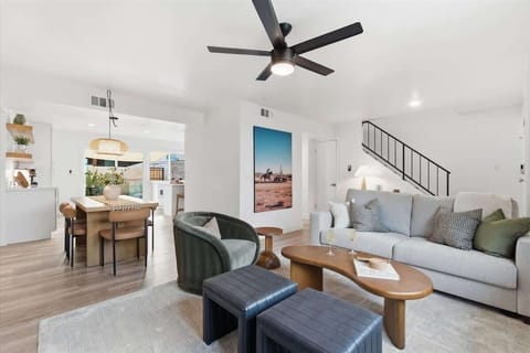 Bright, open living area with comfortable furnishings and a Smart TV, perfect for relaxing together.