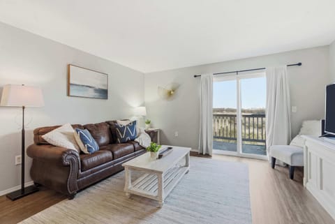 Curl up in the airy living room & stream your favorites on the smart TV​
