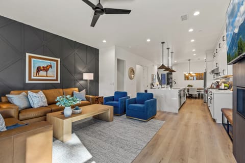 Bright open-concept living room with mountain-modern design and fireplace