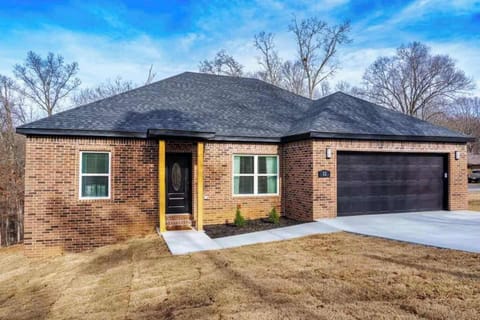Newly built all-brick home with 2-car garage and wooded lot