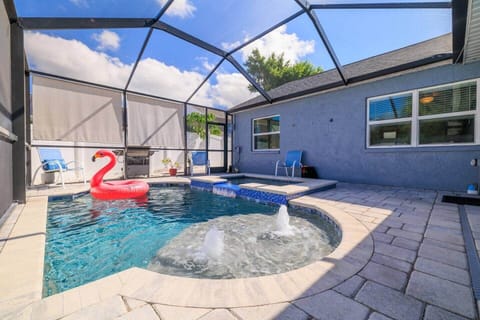 Private Backyard with Pool & Spa | Enjoy a spacious fenced yard featuring a saltwater pool, waterfall spa, and hot tub. It’s the perfect spot to relax, read, or cool off after a day at the beach.