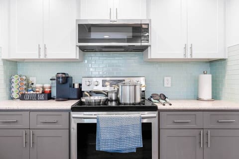Fully Equipped Kitchen | Cook at home with ease. The kitchen includes full-size stainless steel appliances, cookware, utensils, and basic pantry items for simple meal prep or family dinners.