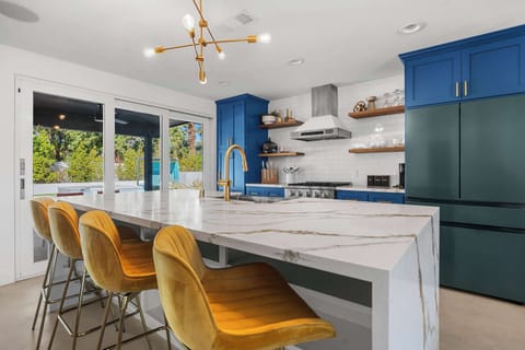 Connect and cook in the open kitchen with bar seating
