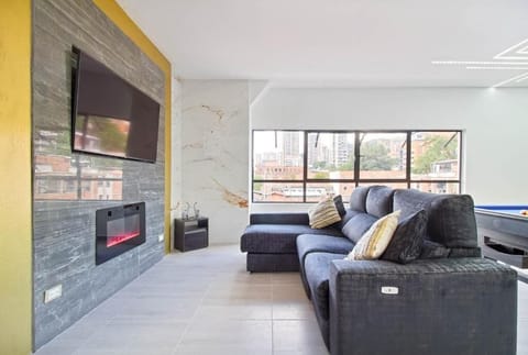 Basic Apartment | Living area | 50-inch flat-screen TV with digital channels