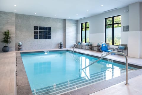 Slip into a serene swim beneath soft, spa-like lighting.