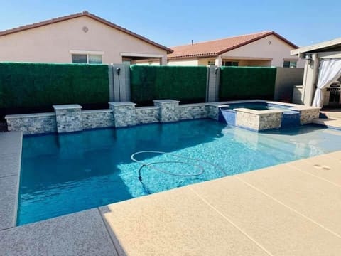 Pool and Heated Spa with outdoor seating
