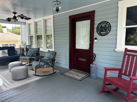 Front porch with rocking chairs, perfect for morning coffee and bird watching!