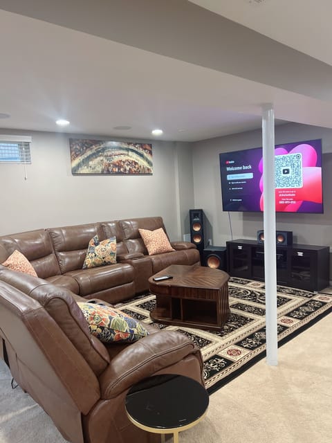 Living room with 75’ TV with great surround sound system. 