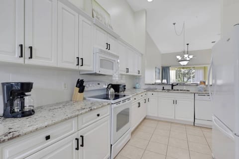 Cookware, dinnerware, many kitchen tools and small appliances are provided, including a drip coffee maker.