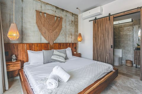 Enjoy restful nights in a serene retreat featuring warm tropical décor and modern comforts.