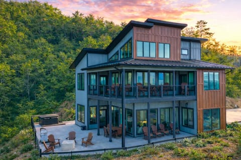 Exterior view of the modern multi-level mountain home with an expansive deck.