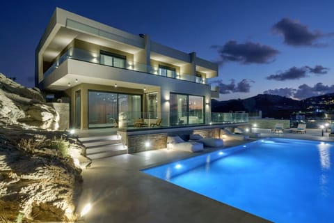 Infinity pool beautifully illuminated at night, creating a serene atmosphere