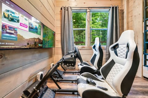 Rev up the fun in our ultimate game room! Featuring a thrilling racing simulator with Xbox Live, it’s the perfect spot to compete, connect, and make unforgettable memories on your trip to the Smoky Mountains.