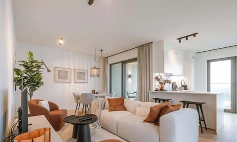 Warm tones, open space, and the North Sea framed in every window - this is floor 16.
