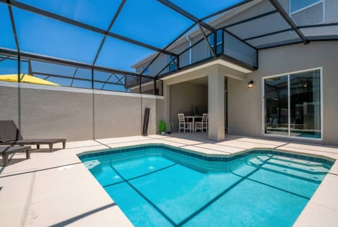 Step outside to your private oasis with a sparkling pool and sleek, modern tiles. Relax in the sunlit seating area, while the protective screen offers comfort and tranquility throughout your stay.