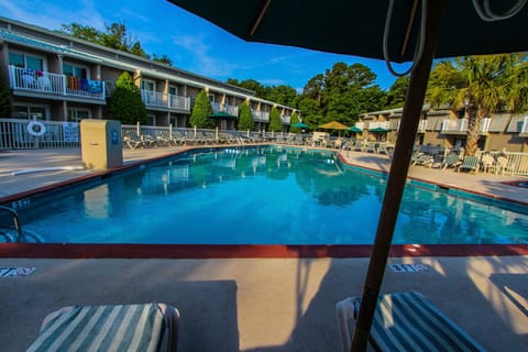 Take in stunning pool views right from your private villa balcony.