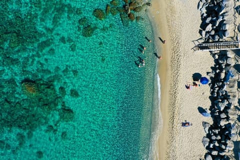 Private beach, white sand, sun loungers, beach umbrellas