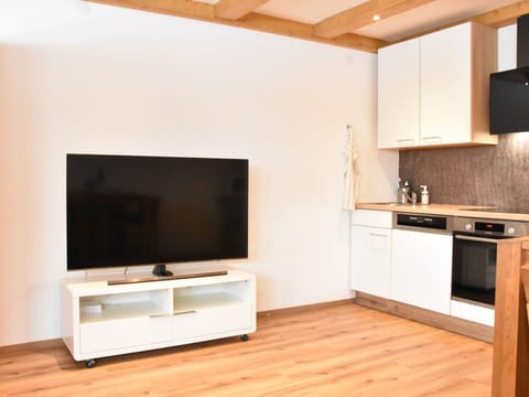 Furniture, Interior Design, Flooring, Wood, Floor, Wood Flooring, Room, Laminate Flooring, Television, Lighting