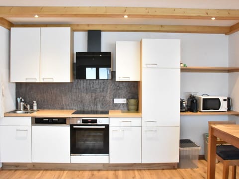 Kitchen, Kitchen Appliance, Countertop, Flooring, Cabinetry, Major Appliance, Furniture, Wood, Interior Design, Floor