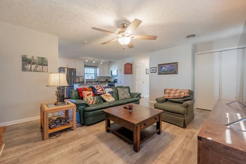 Relax in this bright, open living space—perfect for lounging, chatting, or enjoying a quiet night in.