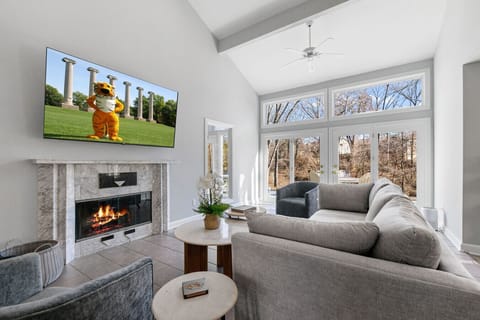 Comfy living room with wood fireplace and cushy couch