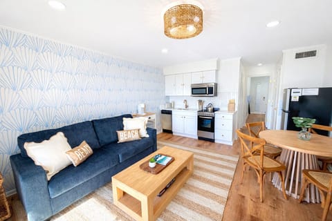 Boutique beach hotel vibes—newly remodeled & stylish living room and kitchen are