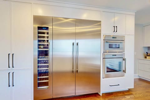 A large Thermador refrigerator and separate wine fridge are features of this lovely kitchen