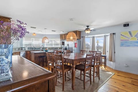 Dining for every occasion! Whether it's a family feast at the 8-seater table, a casual bite at the kitchen island, or a cozy moment at the bistro set, this space is made for gathering and enjoying #DineInStyle 