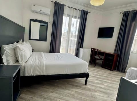Standard Double or Twin Room | Desk, laptop workspace, blackout drapes, rollaway beds