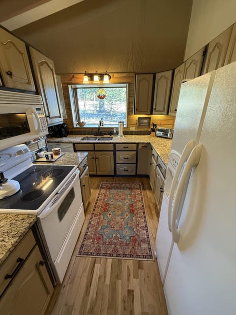 Kitchen with vintage charm and bright window views