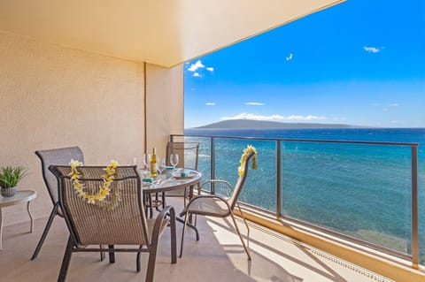 Enjoy your meals with breathtaking views of the Pacific from this private balcony dining setup
