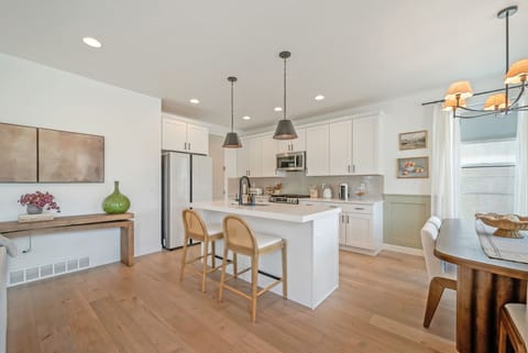 The kitchen at Hygge Ridge is well stocked with all of the amenities and tools a chef needs to cook meals for a group.  The dining table seats 6 and there are 2 additional bar seats at the island