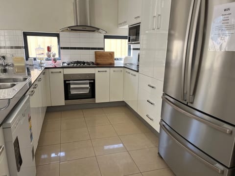 Family House, Garden View | Private kitchen | Full-size fridge, microwave, oven, stovetop