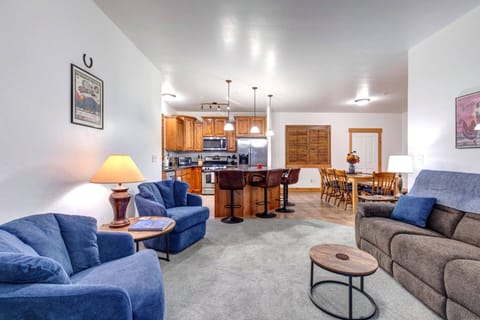 Unwind in your spacious open-plan retreat with plush seating, full kitchen, and dining area perfect for memorable meals together.