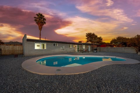 Beautiful private pool (unheated) in the fully fenced and spacious backyard with covered patio and grill