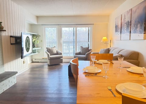 Dining area connected to living room for easy entertaining and socializing.