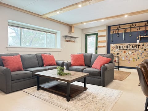 Comfortable living room with `THE BEAST` sign.