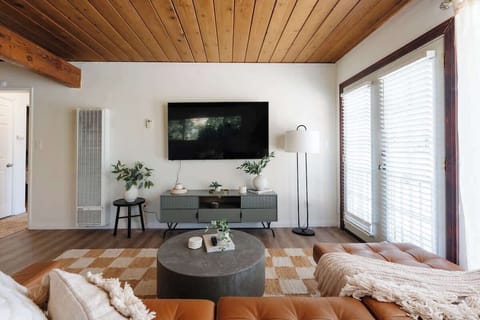 The bright, sun-filled living space invites you to put your feet up, relax and unwind