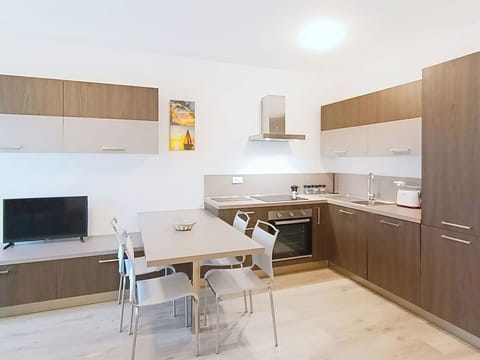 Furniture, Flooring, Interior Design, Wood, Floor, Kitchen, Countertop, Cabinetry, Room, Kitchen Appliance