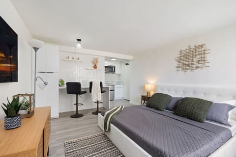 Modern comfort meets minimalist design in this studio, where a plush king-size bed awaits.