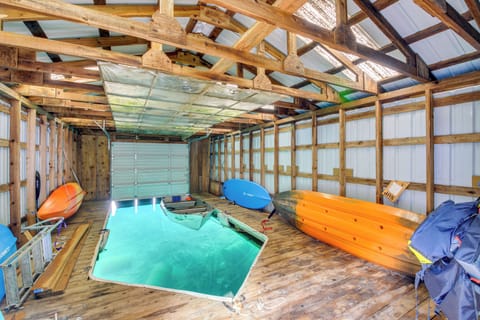 Boat house with two paddle boards provided & space to park your boat! Kayak pictured is not currently available for guest use.  