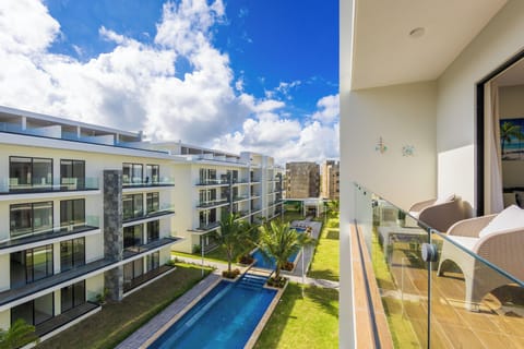 Private balcony with peaceful pool view.