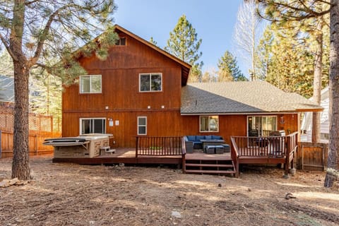 Backyard with small seating area, BBQ and hot tub. Quiet and fenced off.