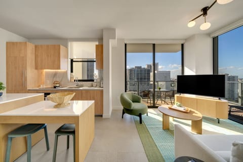 Airy living space with sleek finishes & skyline views