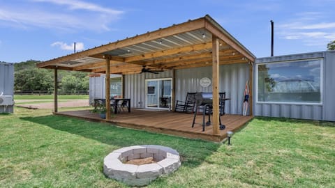 Covered deck by day, fire pit by night—perfect for memorable evenings under the stars.