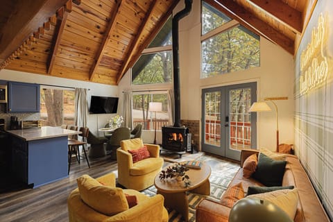 Cozy living/dining room with A-frame windows. 